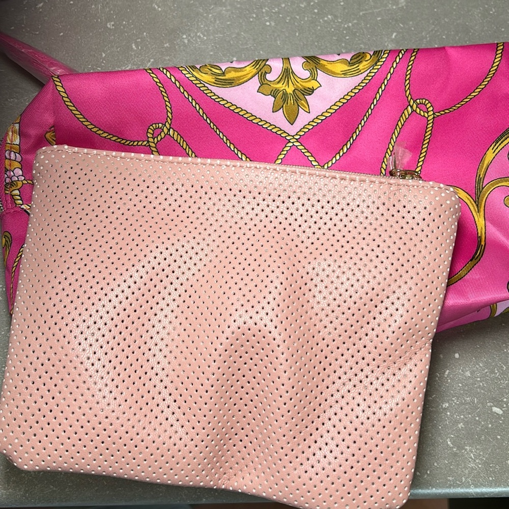 Two pink pouches - 1 pale pink and 1 dark pink with tassels